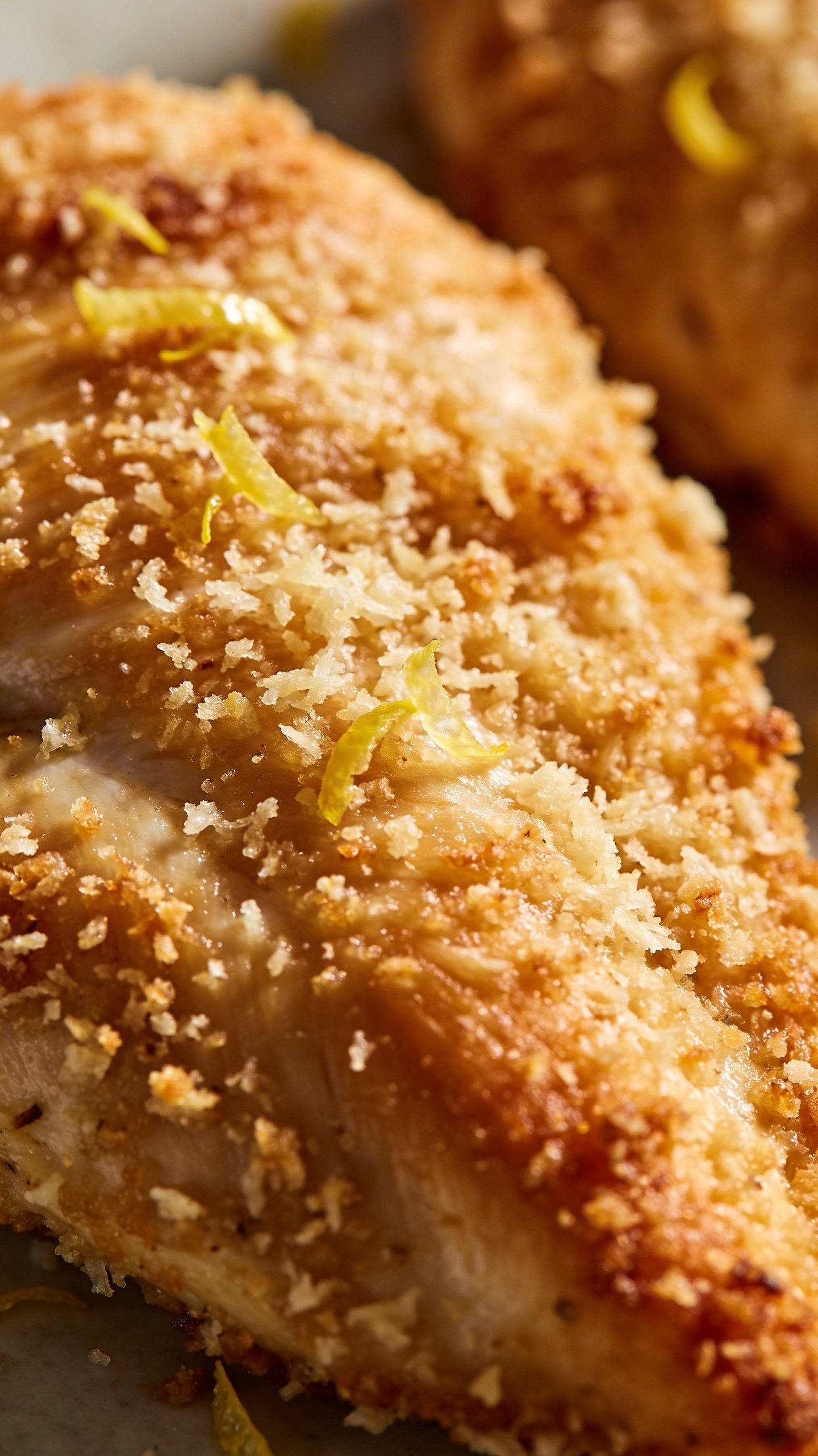 Creamy Pesto Chicken: 30-Min Skillet Wonder 4 closeup of parmesan-crusted chicken breast, lemon zest flecks