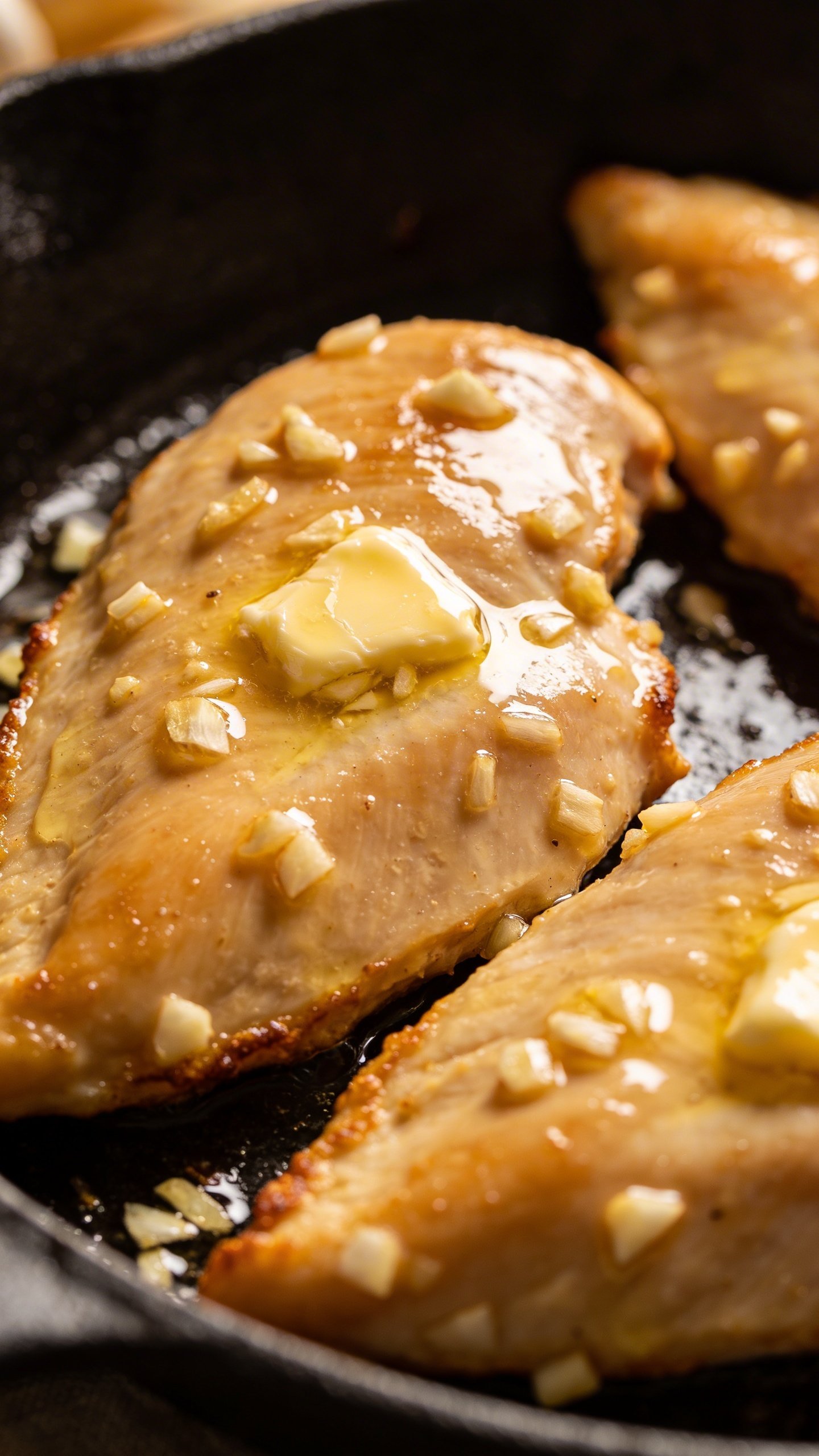 Garlic Butter Chicken: Weeknight Wow in One Pan 3 Closeup of glossy garlic butter chicken breast in skillet