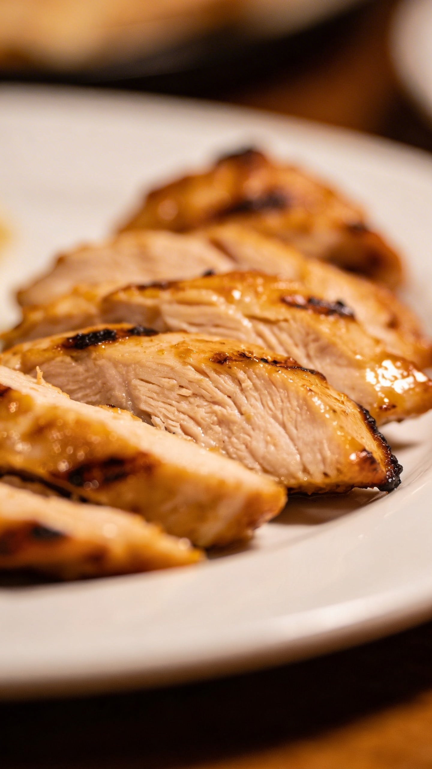 Chicken Shawarma Rice Bowl: Weeknight Wow in One Bowl 3 Closeup of glossy chicken shawarma thigh slices on white plate