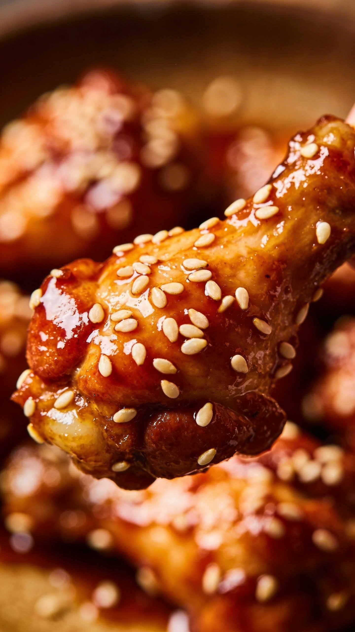 Sticky Sesame Chicken: Glaze That Sticks Like Magic 4 Closeup of sesame seeds clinging to saucy chicken piece, high-contrast lighting